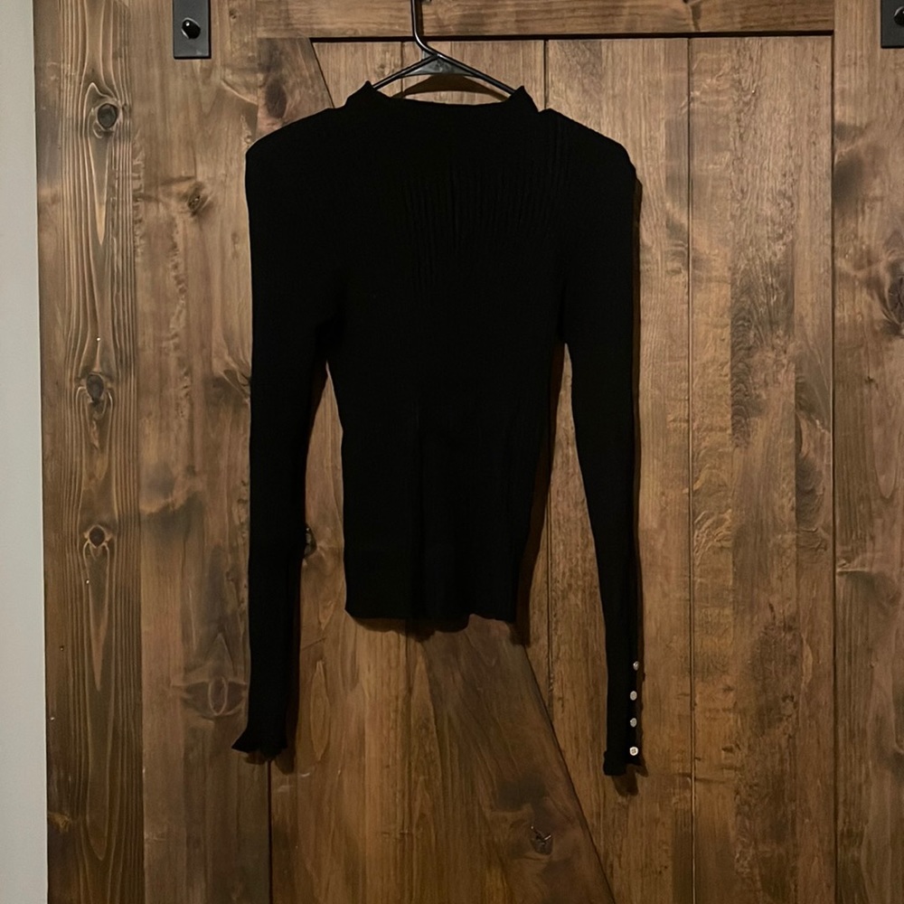 Black turtle neck.